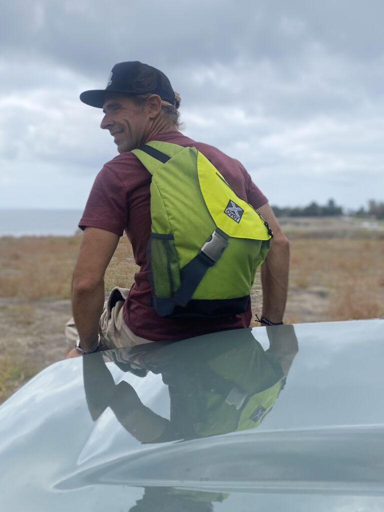 IMG_4066 Man wearing X-over bag sitting on Land Rover hood