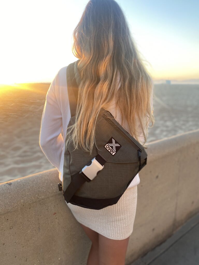 IMG_4634 Woman wearing X-over bag looking at a sunset